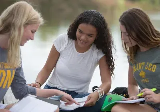 image of students working together on school work